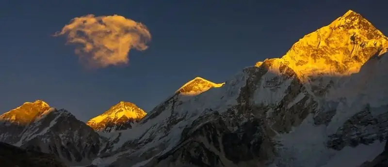 Everest-region peaks lit gold at sunset