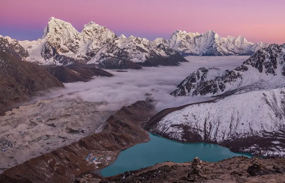 Pink sunset sky over the Gokyo Lakes and the Ngozumpa glacier valley