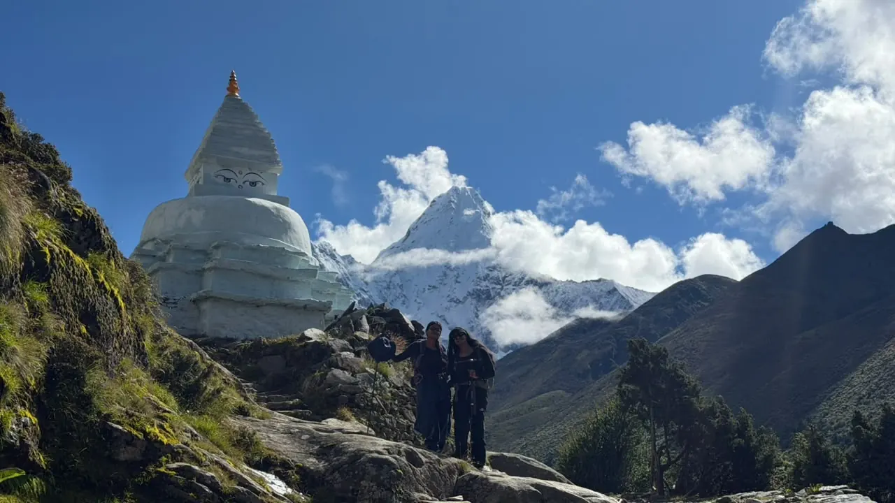 A trailside stupa with Himalayan peaks beyond
