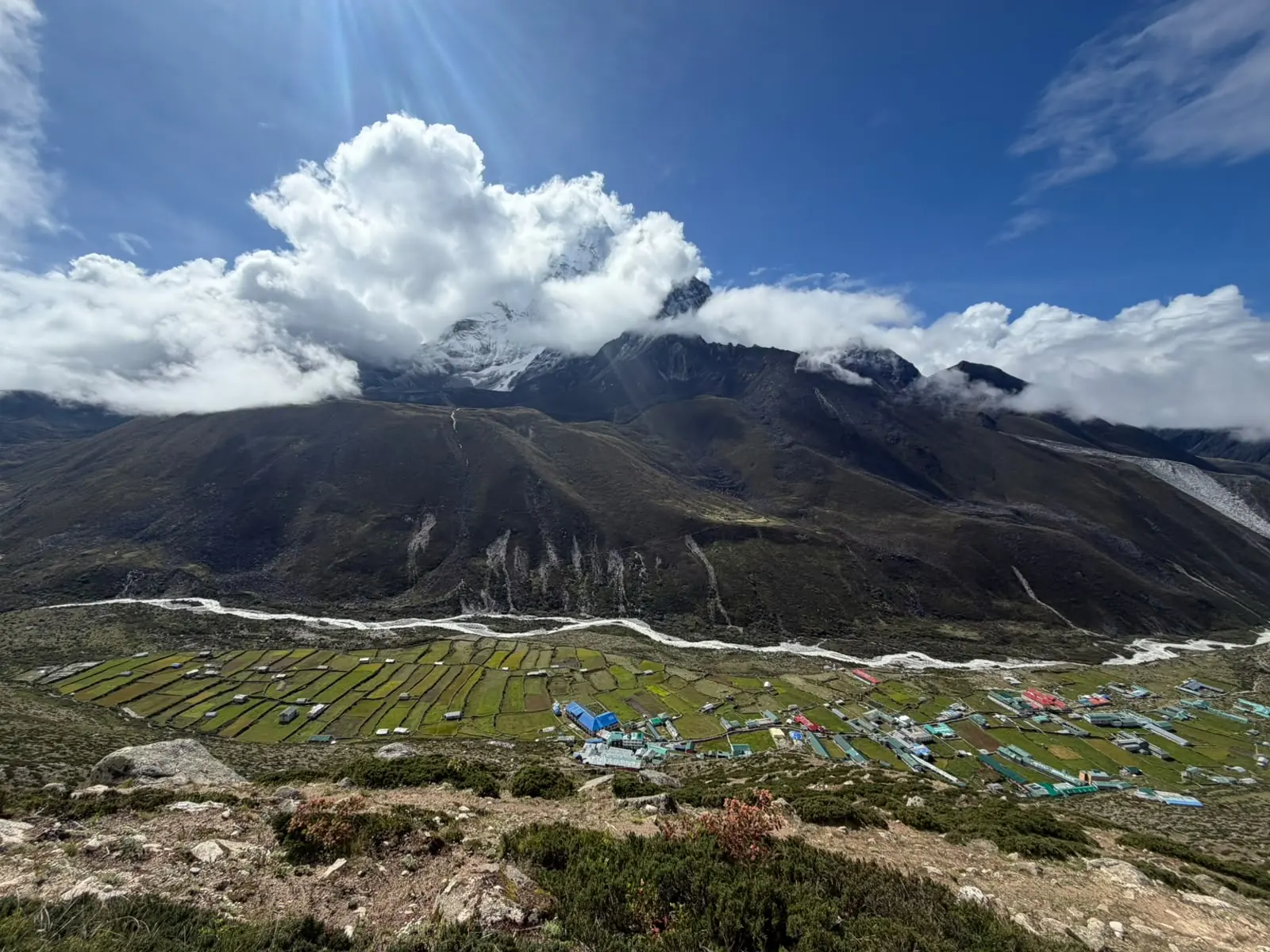 The Khumbu valley as clouds part over the peaks above
